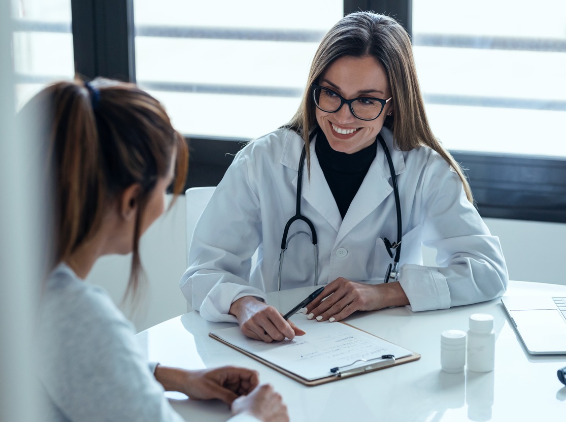 Woman DPC doctor with patient